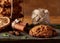 Christmas composition with chocolate biscuits, cinnamon and dried oranges on wooden background, close-up.