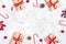 Christmas composition. Christmas decoration gifts, glitter, Christmas balls, candy, snowflakes on gray concrete background.