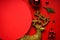 Christmas composition. Christmas gold and red decorations on a red background, place for text, flat lay