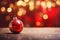 Christmas composition. Christmas toys and candles on a blurred background. Bright holiday lights. Selective focus. Space for copy