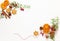 Christmas composition with cookies, dried oranges, cinnamon sticks and herbs on white background. Natural food ingredient for