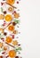 Christmas composition with cookies, dried oranges, cinnamon sticks and herbs on white background. Natural food ingredient for