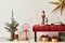 Christmas composition with decoration, christmas tree, gifts, snow and accessories in cozy home decor. Copy space.
