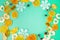 Christmas composition. Fruits, Snowflakes, Fir Cones on green background. Fruit and holiday pattern. Flat lay, top view, copy