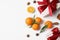 Christmas composition with gift boxes, ripe tangerines on white background