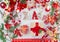 Christmas composition with gift, Christmas ball, word  Xmas and wrapping paper. Red winter decoration, Christmas mood on white