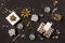 Christmas composition. Gold and silver decorations, mirror disco balls, gifts on  dark black background