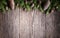 Christmas composition made of fir branches, various cones on rustic vintage wooden background