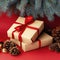 Christmas composition of pine cones, spruce branches and stack of gift boxes on red background