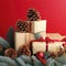 Christmas composition of pine cones, spruce branches and stack of gift boxes on red background