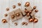 Christmas composition.Present boxes with twine and craft paper,golden acorns and balls.White wooden table