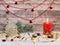 Christmas composition of the red Christmas candle, ball and bells