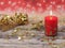 Christmas composition of the red Christmas candle, gold stars, fir tree and garland