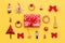 Christmas composition. Red christmas gift and many retro christmas ornaments isolated on bright yellow background.