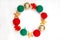 Christmas composition. Red and green balls of yarn, gifts with a red bow on a white background. Bright yarn knitting concept. Flat