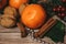 Christmas composition of tangerines, cinnamon sticks, spruce fir branches, walnuts, and brilliant decorations