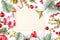 Christmas composition. Vintage paper background with copy space and red holly berries, golden stars and green fir branch on white