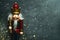 Christmas concept background. Top view of Christmas wooden nutcracker toy solider with space for text