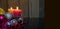 Christmas concept banner with two red candles lighting on wooden background