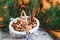 Christmas Concept Basket with Assorted Mixed Nuts Peanuts Almonds Hazelnuts Pine Branch Yellow Blanket Cozy Healthy Concept Autumn