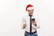 Christmas Concept - Handsome Business man talking on phone and holding glass of champange celebrating Chirstmas and New