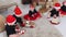 Christmas concept - Little babies sitting on the carpet and playing with christmas balls and toys in the decorated