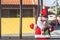 Christmas concept with plush Santa Claus and a sign written Merry Christmas copy space on the left