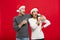 Christmas Concept - portrait lovely young couple finger on side