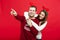 Christmas Concept - portrait lovely young couple finger on side well use for presentation or montage