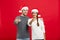 Christmas Concept - portrait lovely young couple finger on side well use for presentation or montage