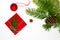 Christmas concept: red envelope decorated with a pine branch, ch
