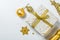 Christmas concept - silver and gold presents with confetti and ribbon