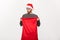 Christmas concept - Young beard handsome man exciting open santa big bag for present.