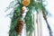 Christmas coniferous and cotton plant wreath hanging on wooden sledge outdoors