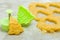 Christmas cookies for children, making gingerbread in shape of fir tree. Raw dough and form for preparation cookie. New year treat