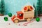 Christmas cookies with jam in toy truck on wooden table