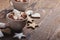 Christmas cookies sprinkled with powdered sugar and cups of hot chocolate with marshmallows