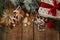 Christmas cookies, stylish gift, festive decorations on rustic wooden table. Atmospheric stylish christmas composition, flat lay