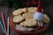 Christmas cookies tiger head with a sitting gnome wooden background