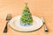 Christmas cooking concept. Dinner plate with Christmas tree. 3D rendering