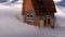 Christmas cottage on the snow