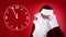 Christmas countdown. Clock showing five minutes to midnight near Santa Claus on red background