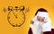 Christmas countdown. Clock showing five minutes to midnight near Santa Claus on yellow background