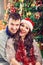 Christmas couple happily smiling enjoying holidays and snow
