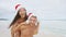 Christmas couple having fun on beach vacation
