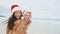 Christmas couple having fun on beach vacation