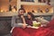 Christmas couple looking movie and eat popcorn in bed