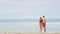 Christmas couple relaxing on beach vacation