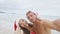 Christmas couple selfie picture on beach vacation