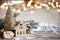 Christmas cozy background with decor details, snow and blurry lights copy space